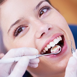 Woman receiving dental exam