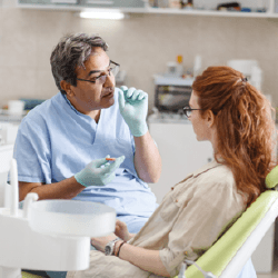 Dentist talking to patient about tooth extractions