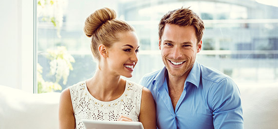 Young happy couple with gorgeous smiles