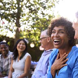 group of people laughing together outside