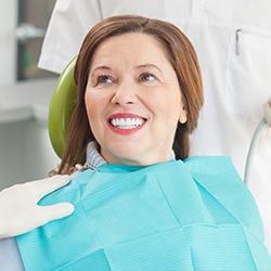 Woman in dental chair smiling