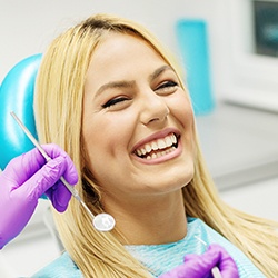 Laughing woman in dental chair