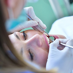 Relaxed woman receiving dental treatment