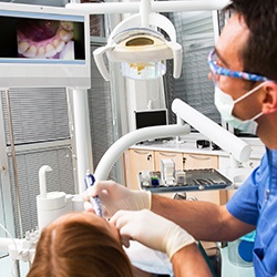 Dentist and patient looking at intraoral photos