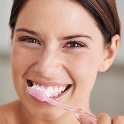 Woman brushing teeth