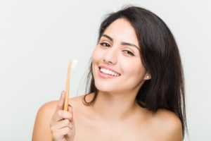 woman using eco-friendly oral hygiene products